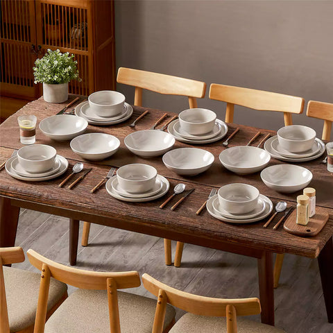 A glossy grey 24-piece stoneware dinnerware set from the Playa collection - featuring farmhouse charm with plates and bowls for 6 people-vancasso