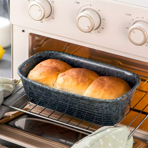 Presti rectangular bread baker in deep blue with a subtle rim pattern - glossy finish - perfect for baking bread with a stylish touch-vancasso
