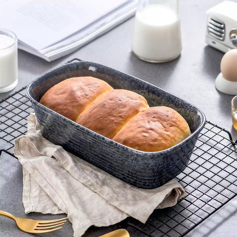 Presti rectangular bread baker in deep blue with a subtle rim pattern - glossy finish - perfect for baking bread with a stylish touch-vancasso