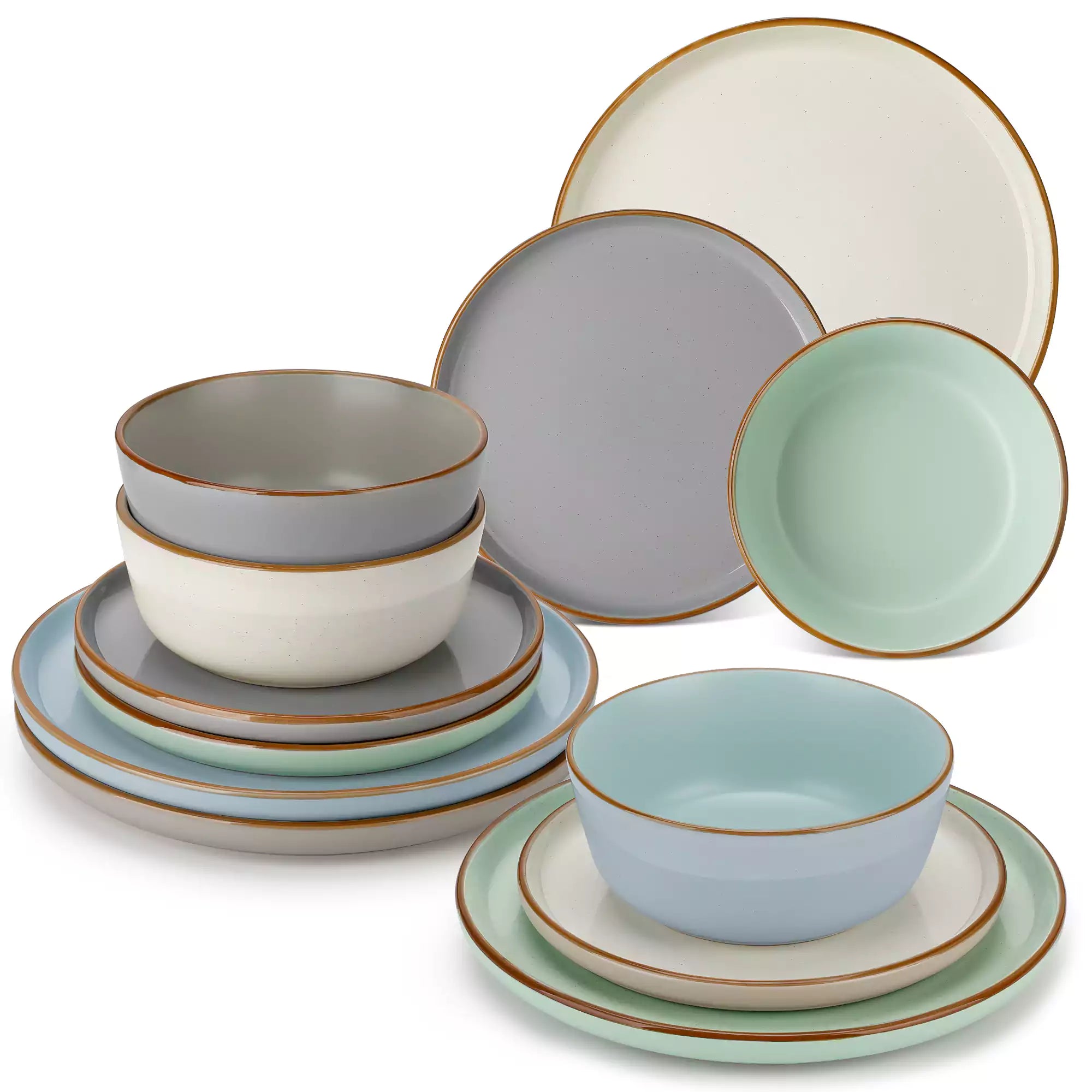 Assorted rustic stoneware dinnerware set with speckled - lipped-edge plates and bowls on a dining table with flowers and cutlery in a cozy modern kitchen-vancasso