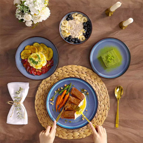 Sata blue stoneware dinnerware set styled dining table with dinner plates salad plates pasta bowls cereal bowls silverware and floral centerpiece farmhouse reactive glaze service for 6