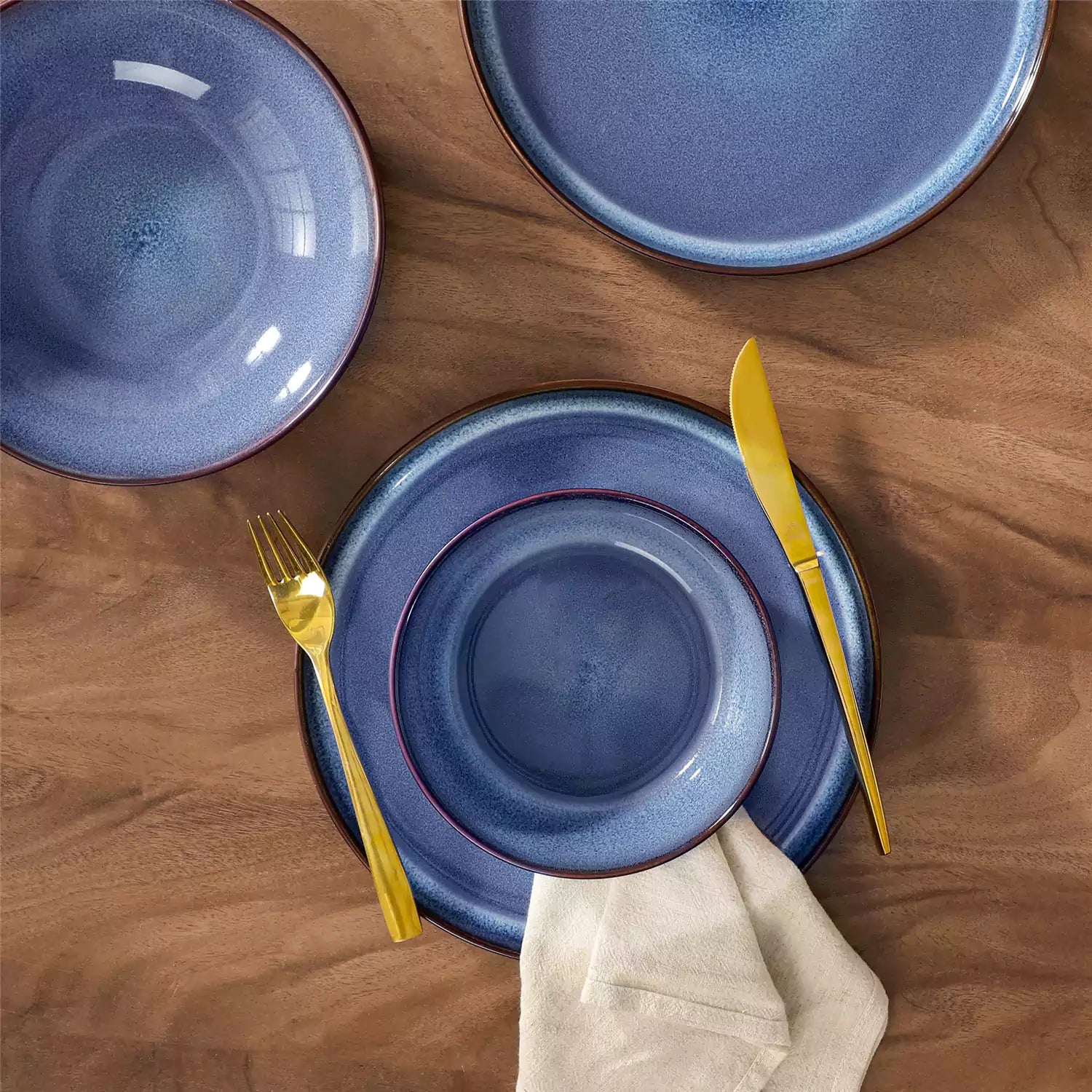 Sata blue stoneware dinnerware set styled dining table with dinner plates salad plates pasta bowls cereal bowls silverware and floral centerpiece farmhouse reactive glaze service for 6