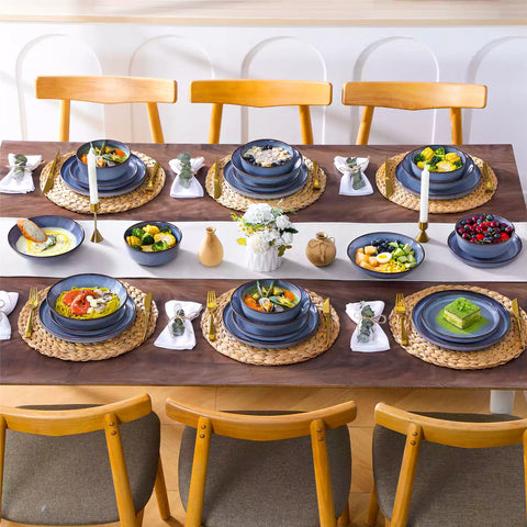 Sata blue stoneware dinnerware set styled dining table with dinner plates salad plates pasta bowls cereal bowls silverware and floral centerpiece farmhouse reactive glaze service for 6