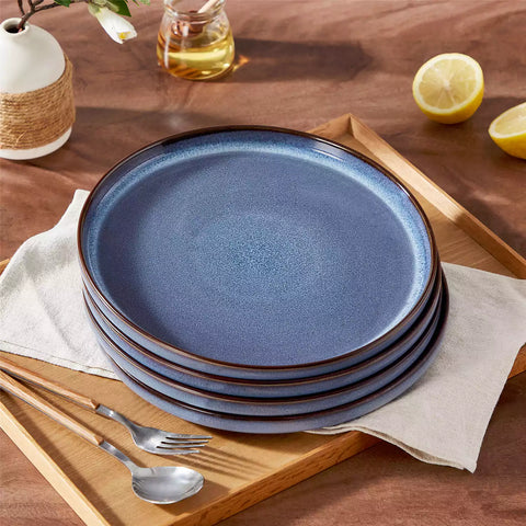 Sata blue stoneware dinner plate set of 4 styled with lamb chops and vegetables on a dinner table farmhouse lipped edge reactive glaze one of a kind finish