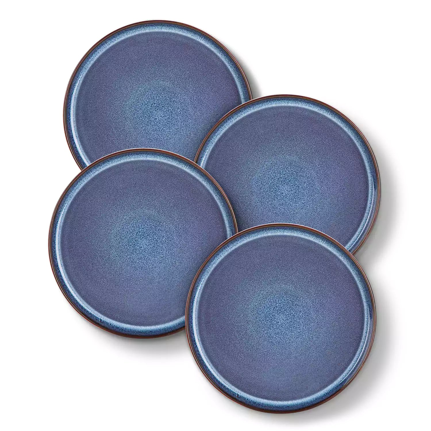 Sata blue stoneware dinner plate set of 4 styled with lamb chops and vegetables on a dinner table farmhouse lipped edge reactive glaze one of a kind finish