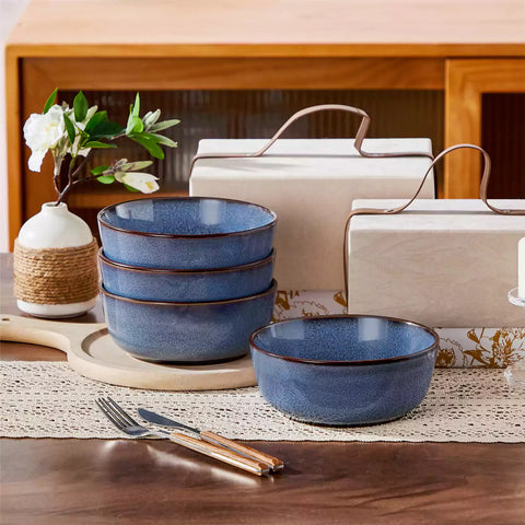 Sata blue stoneware cereal bowls set of 4 with assorted meals styled on a wooden table with lace tablecloth farmhouse reactive glaze lipped edge artisan finish