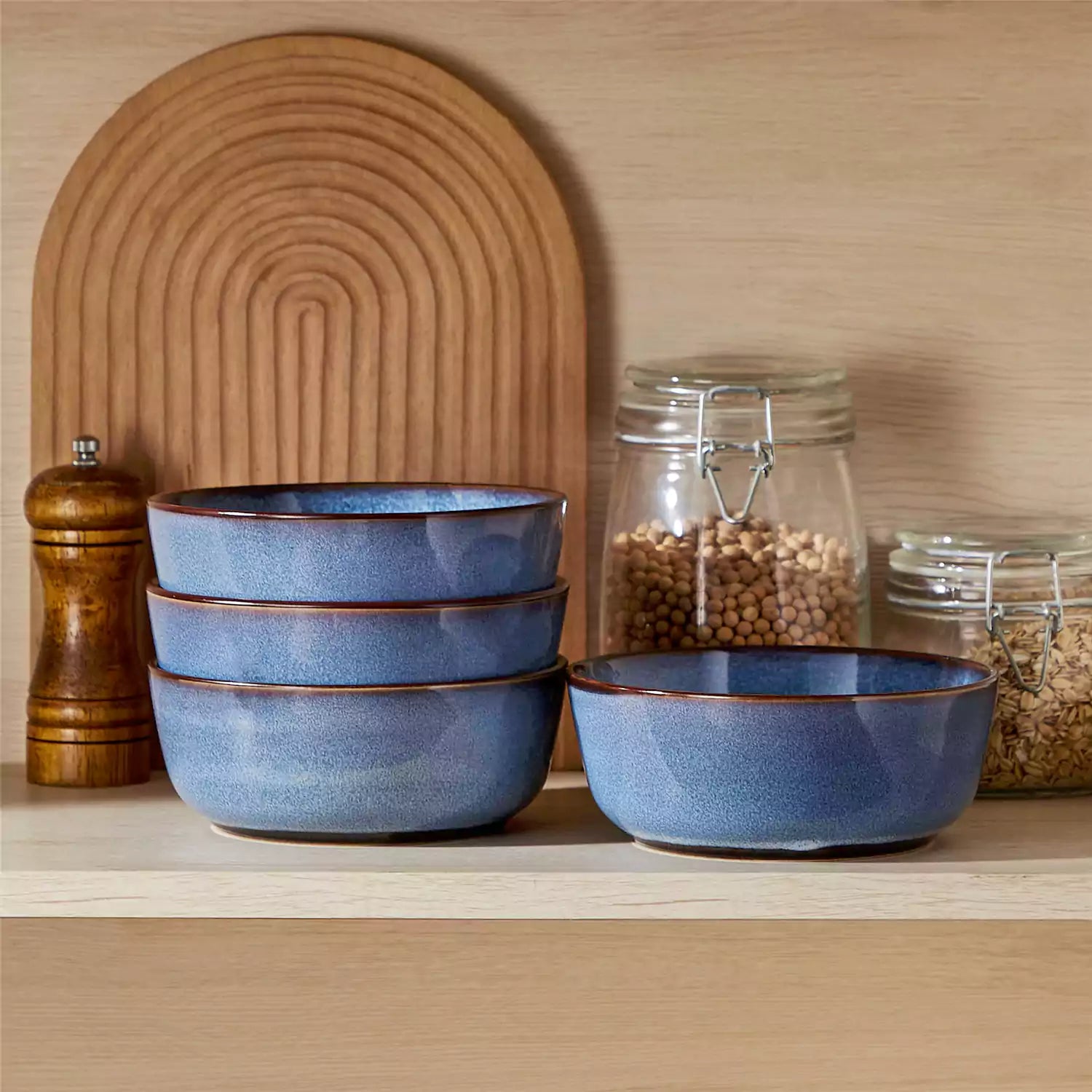 Sata blue stoneware cereal bowls set of 4 with assorted meals styled on a wooden table with lace tablecloth farmhouse reactive glaze lipped edge artisan finish