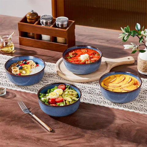 Sata blue stoneware cereal bowls set of 4 with assorted meals styled on a wooden table with lace tablecloth farmhouse reactive glaze lipped edge artisan finish