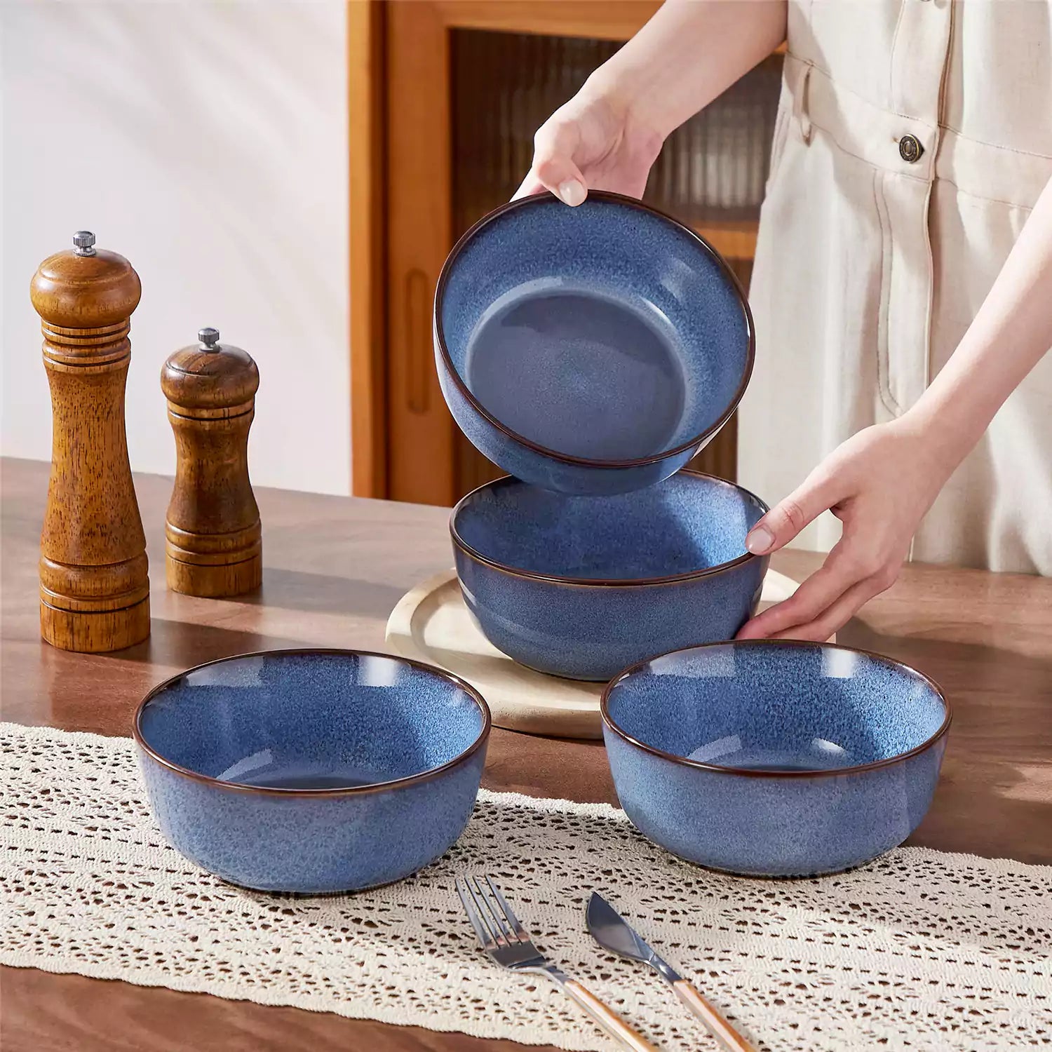 Sata blue stoneware cereal bowls set of 4 with assorted meals styled on a wooden table with lace tablecloth farmhouse reactive glaze lipped edge artisan finish