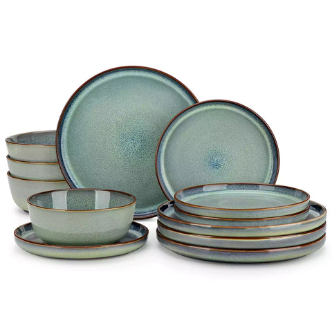 Sata green stoneware 12 piece dinnerware set with dinner plates salad plates and cereal bowls styled with gold cutlery on textured surface farmhouse reactive glaze lipped edge service for 4