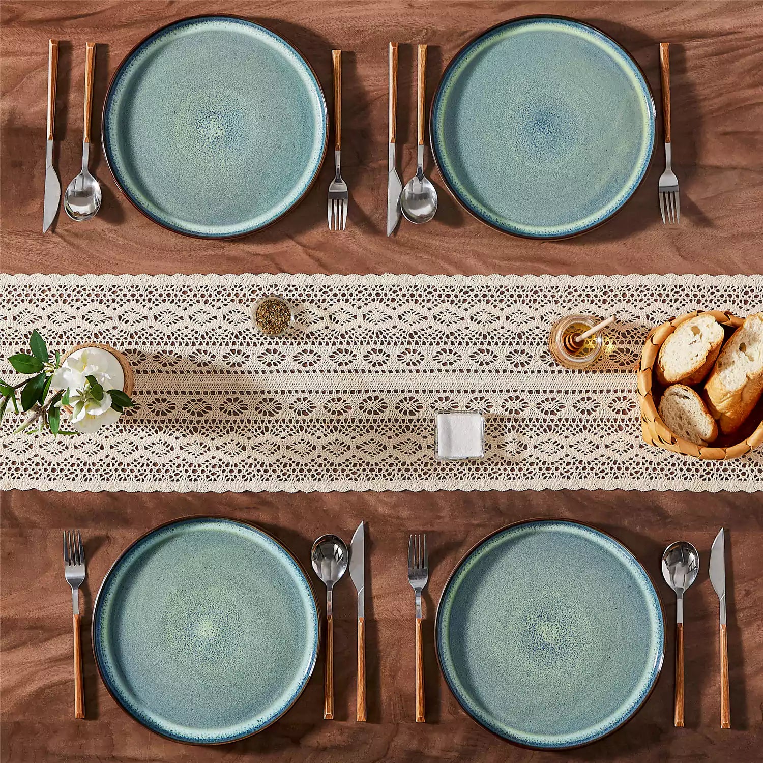 Sata green stoneware dinner plate set of 4 styled with lamb chops and vegetables on a dinner table farmhouse lipped edge reactive glaze one of a kind finish