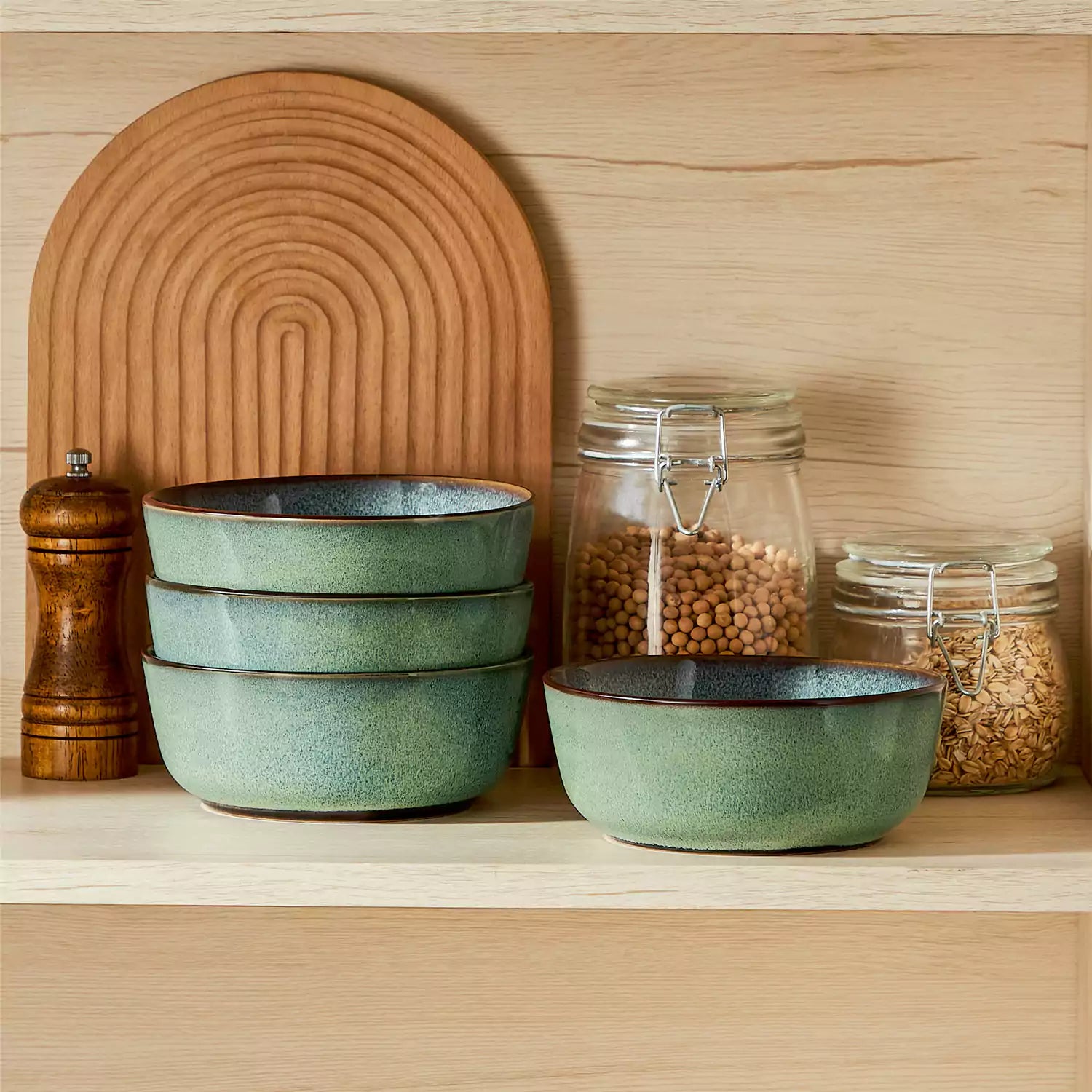Sata green stoneware cereal bowls set of 4 with assorted meals styled on a wooden table with lace tablecloth farmhouse reactive glaze lipped edge artisan finish