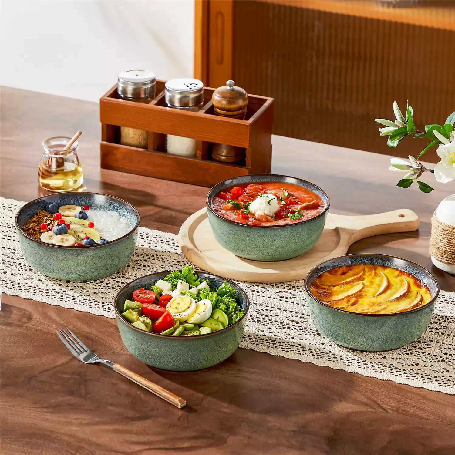 Sata green stoneware cereal bowls set of 4 with assorted meals styled on a wooden table with lace tablecloth farmhouse reactive glaze lipped edge artisan finish