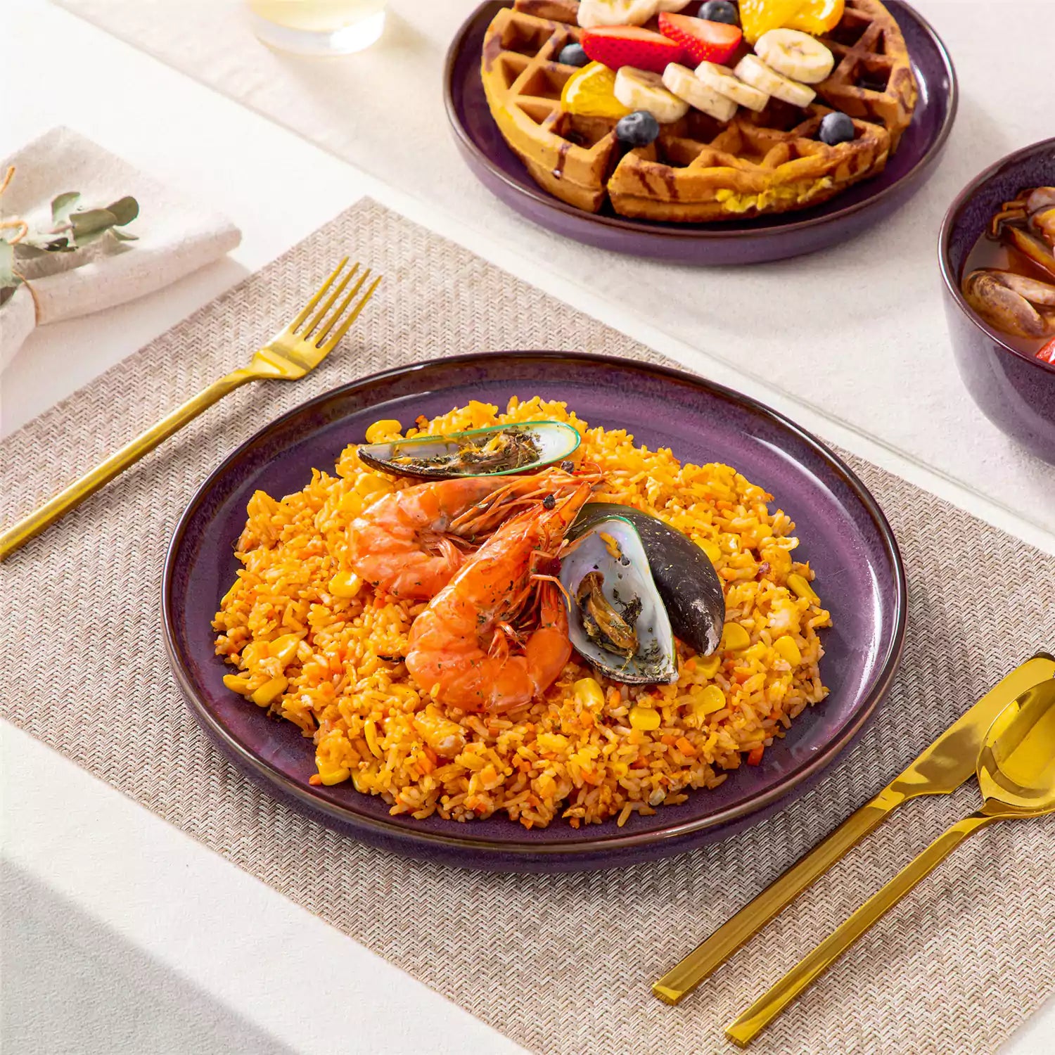 Sata purple stoneware 12 piece dinnerware set with dinner plates salad plates and cereal bowls styled with gold cutlery on textured surface farmhouse reactive glaze lipped edge service for 4