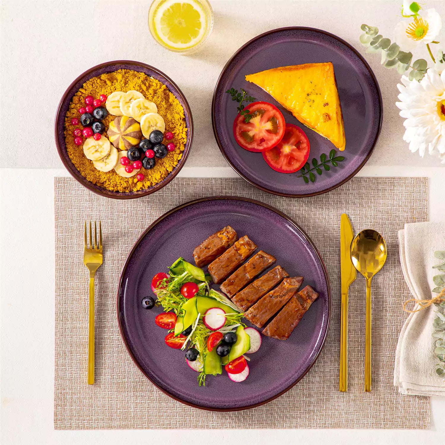 Sata purple stoneware 12 piece dinnerware set with dinner plates salad plates and cereal bowls styled with gold cutlery on textured surface farmhouse reactive glaze lipped edge service for 4