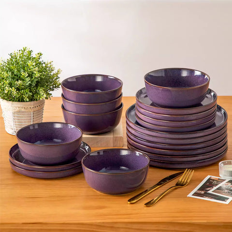 Sata purple stoneware 18 piece dinnerware set with dinner plates salad plates and cereal bowls styled on a wooden table with diverse meal setup farmhouse reactive glaze lipped edge service for 6