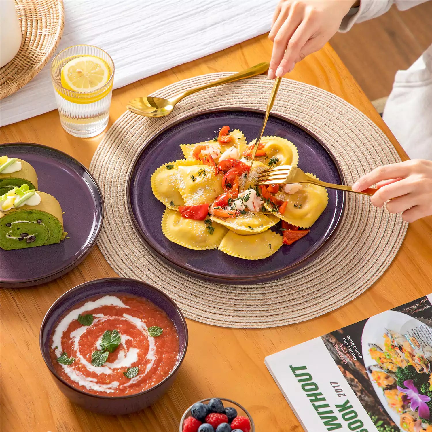 Sata purple stoneware 18 piece dinnerware set with dinner plates salad plates and cereal bowls styled on a wooden table with diverse meal setup farmhouse reactive glaze lipped edge service for 6