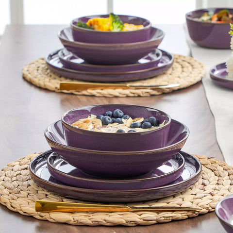 Sata purple stoneware dinnerware set styled dining table with dinner plates salad plates pasta bowls cereal bowls silverware and floral centerpiece farmhouse reactive glaze service for 6