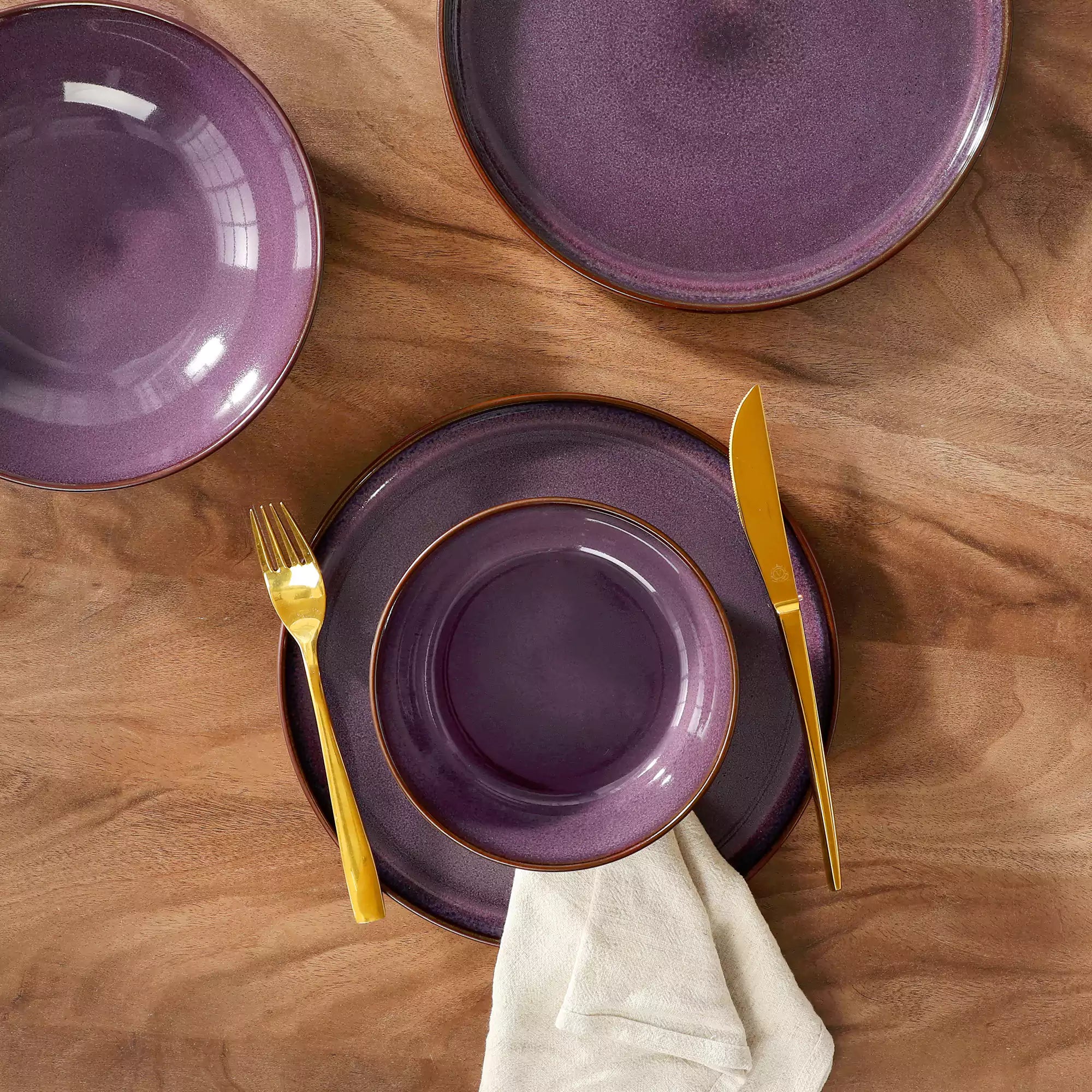 Sata purple stoneware dinnerware set styled dining table with dinner plates salad plates pasta bowls cereal bowls silverware and floral centerpiece farmhouse reactive glaze service for 6