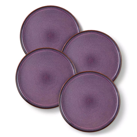 Sata purple stoneware dinner plate set of 4 styled with lamb chops and vegetables on a dinner table farmhouse lipped edge reactive glaze one of a kind finish
