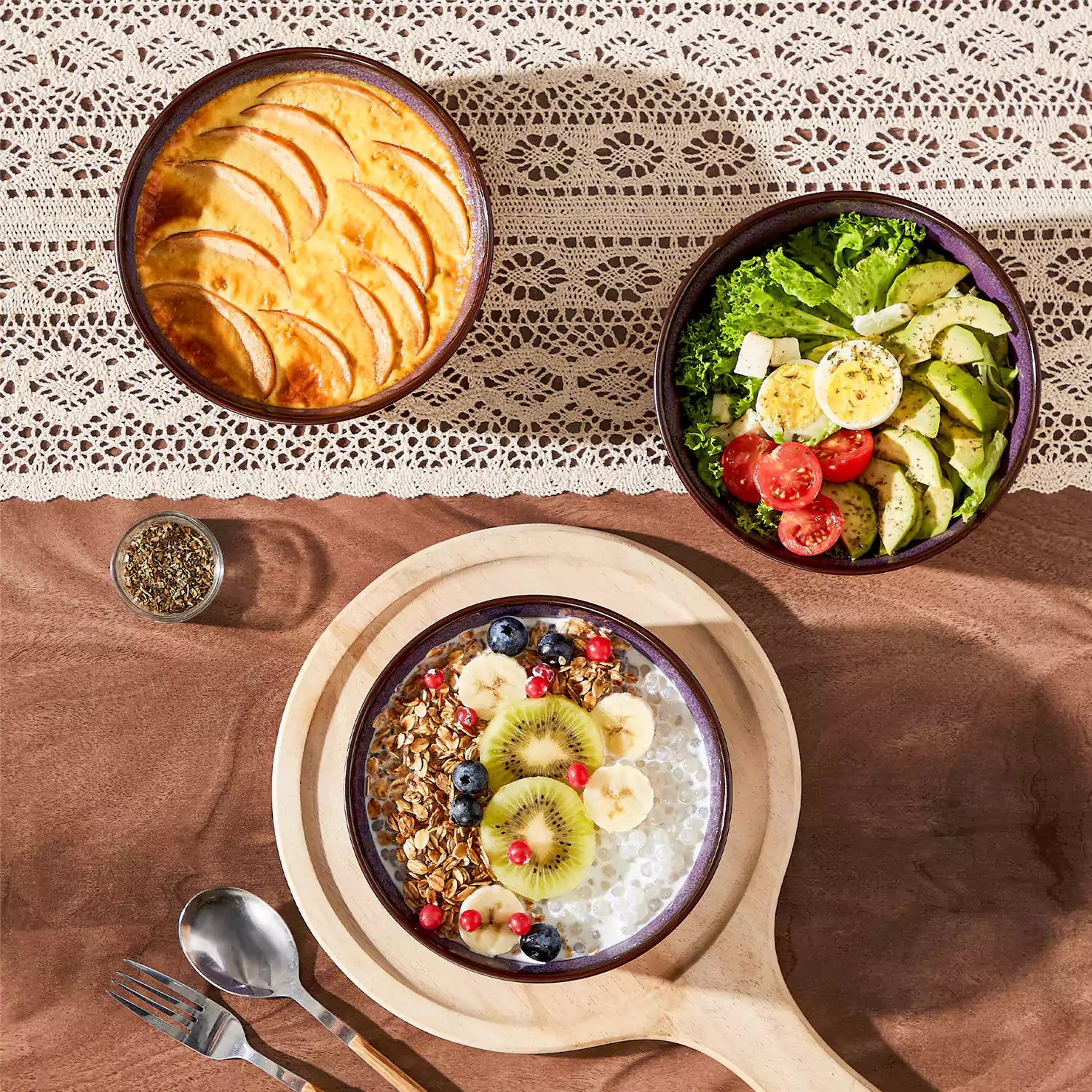 Sata purple stoneware cereal bowls set of 4 with assorted meals styled on a wooden table with lace tablecloth farmhouse reactive glaze lipped edge artisan finish