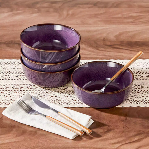 Sata purple stoneware cereal bowls set of 4 with assorted meals styled on a wooden table with lace tablecloth farmhouse reactive glaze lipped edge artisan finish