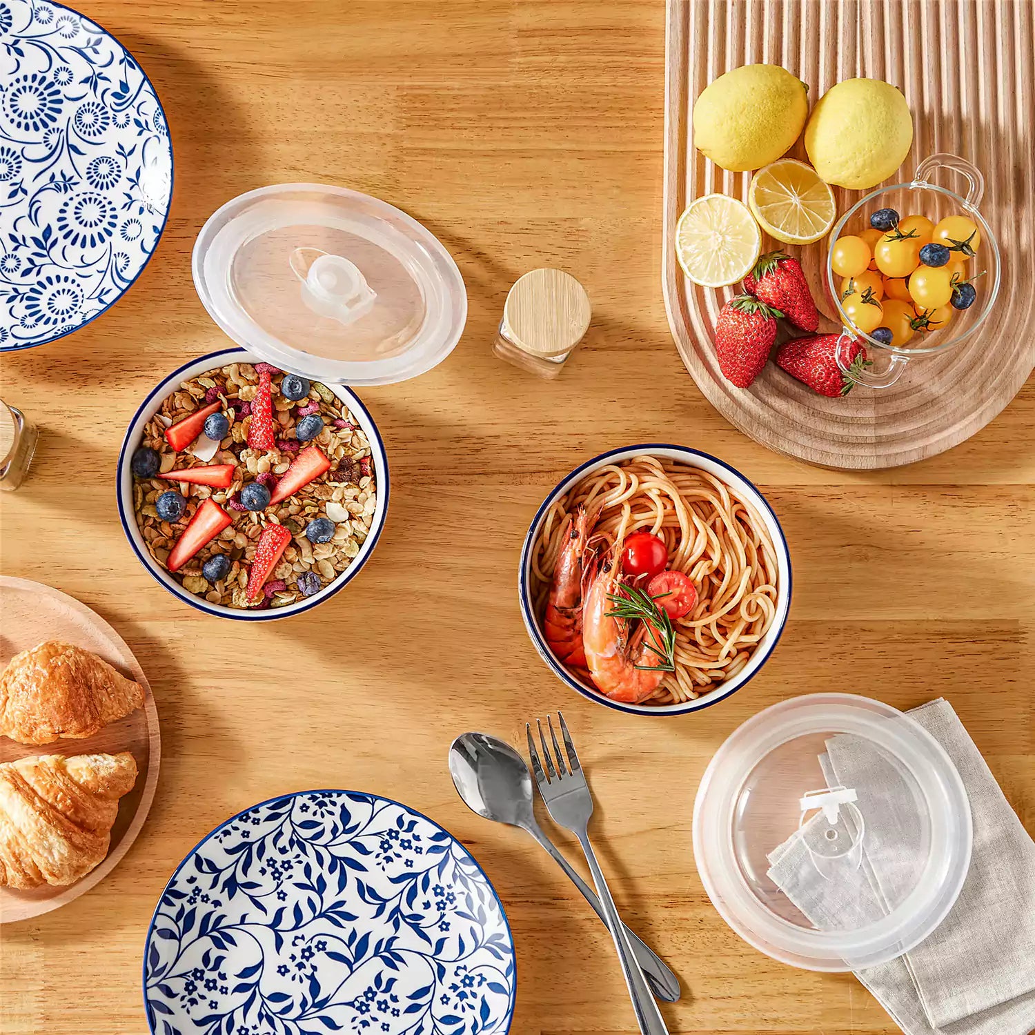 Selene blue-and-white floral porcelain food storage bowls set of 2 styled with fresh fruit and noodles on rustic wood table Japanese-inspired ceramic kitchenware for modern home dining