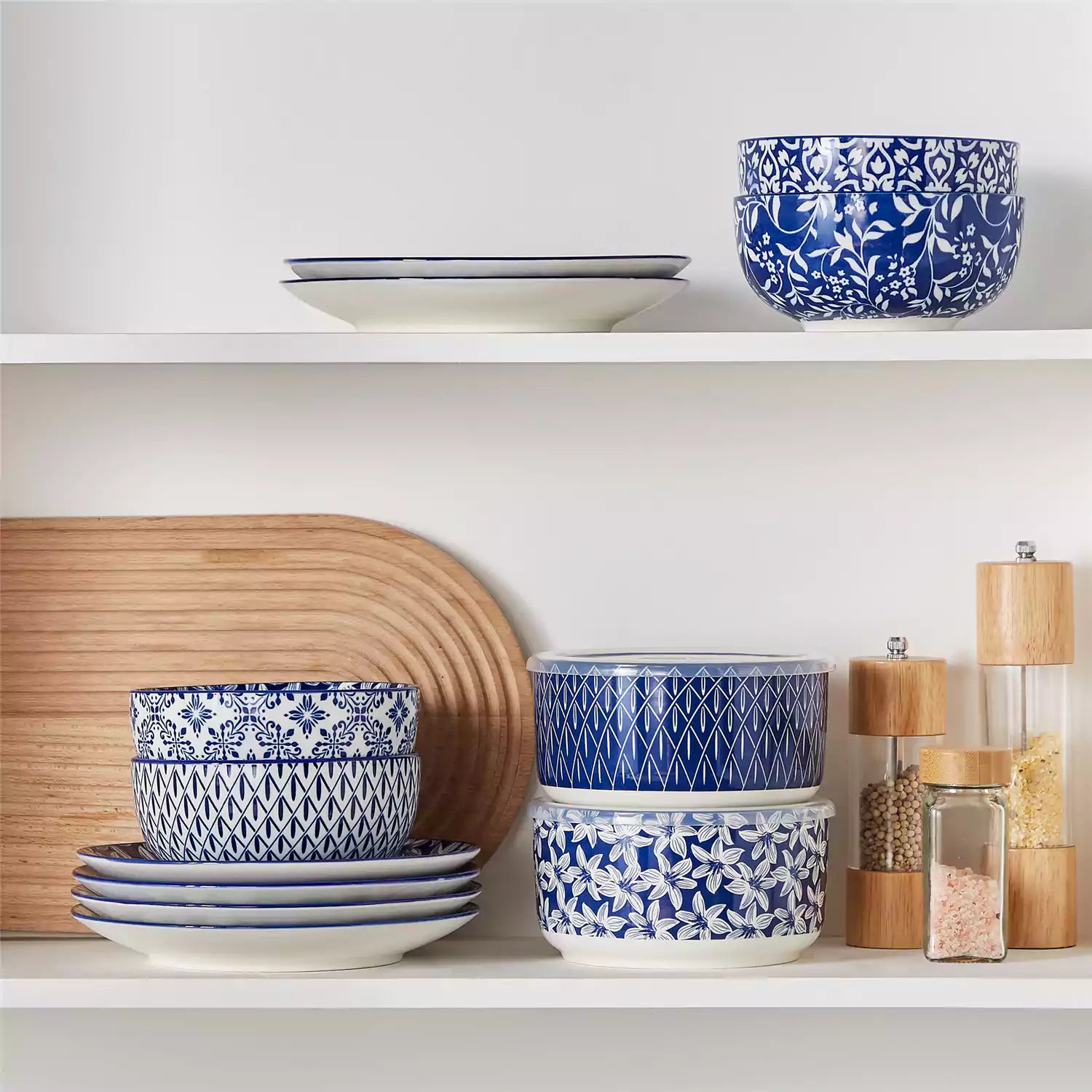 Selene deep blue and white floral porcelain food storage bowls set of 2 styled with fresh fruit and noodles on rustic wood table Japanese inspired ceramic kitchenware