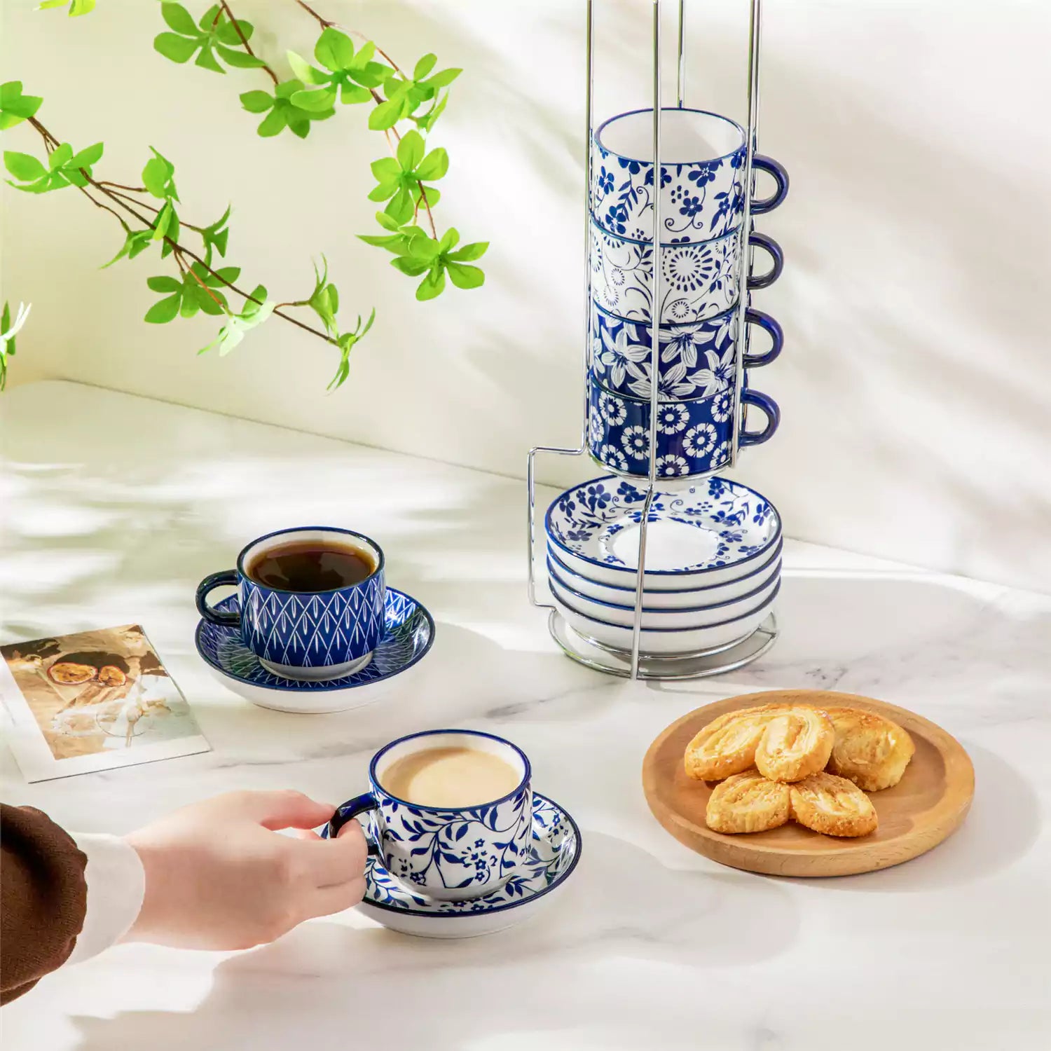 Stackable Selene 5oz blue and white indigo pattern porcelain espresso cups and saucers with a minimalist metal organizer