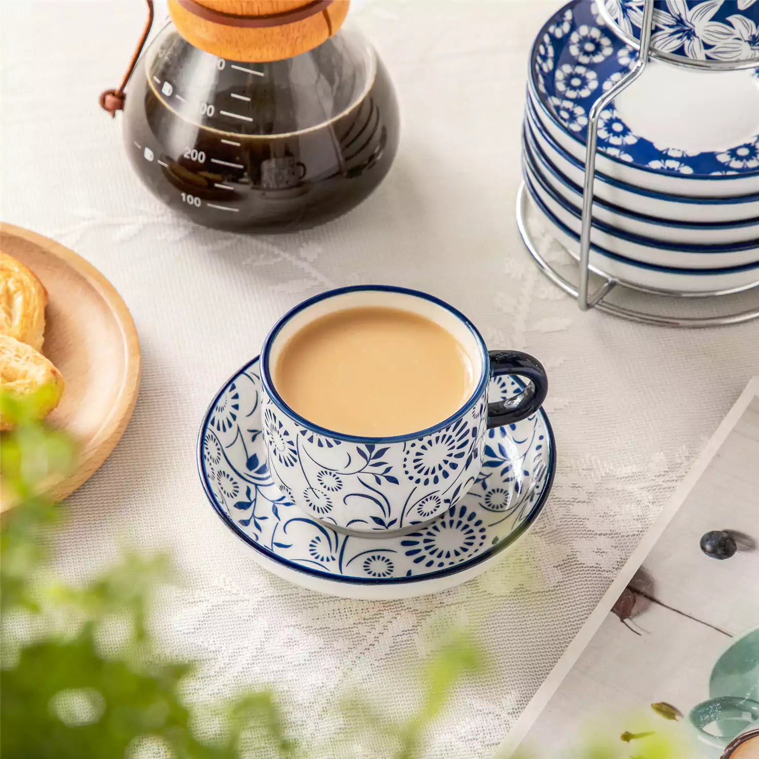 Stackable Selene 5oz blue and white indigo pattern porcelain espresso cups and saucers with a minimalist metal organizer