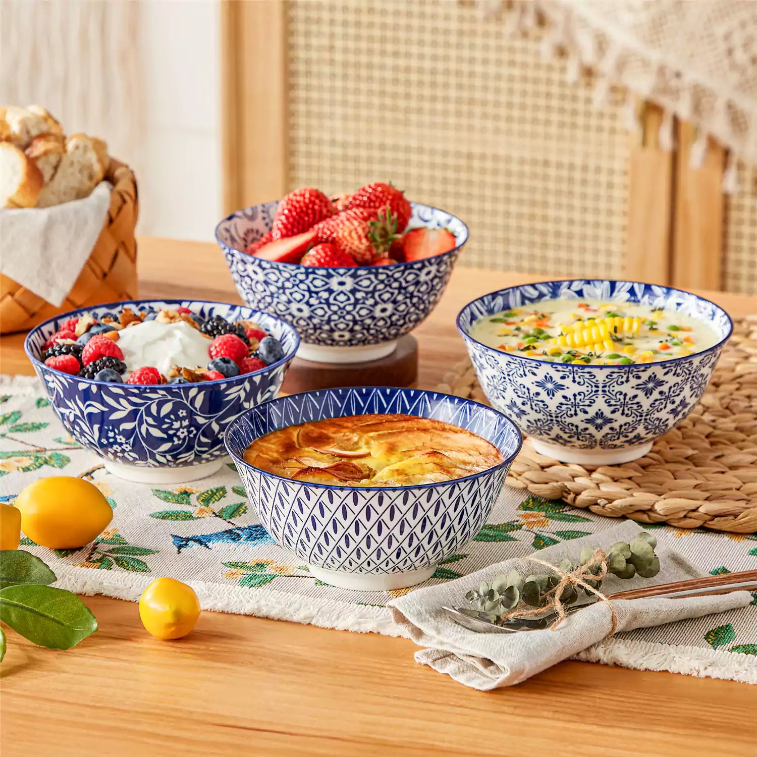 Selene porcelain cereal bowls set of 4 blue and white Japanese inspired floral pattern mix and match tableware styled with fruits and dishes on dining table