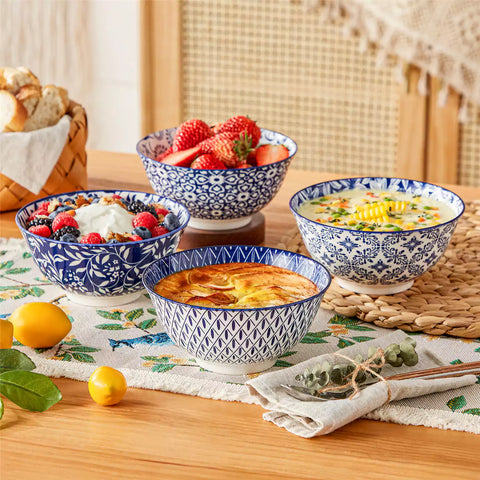 Selene porcelain cereal bowls set of 4 blue and white Japanese inspired floral pattern mix and match tableware styled with fruits and dishes on dining table