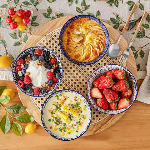 Selene porcelain cereal bowls set of 4 blue and white Japanese inspired floral pattern mix and match tableware styled with fruits and dishes on dining table