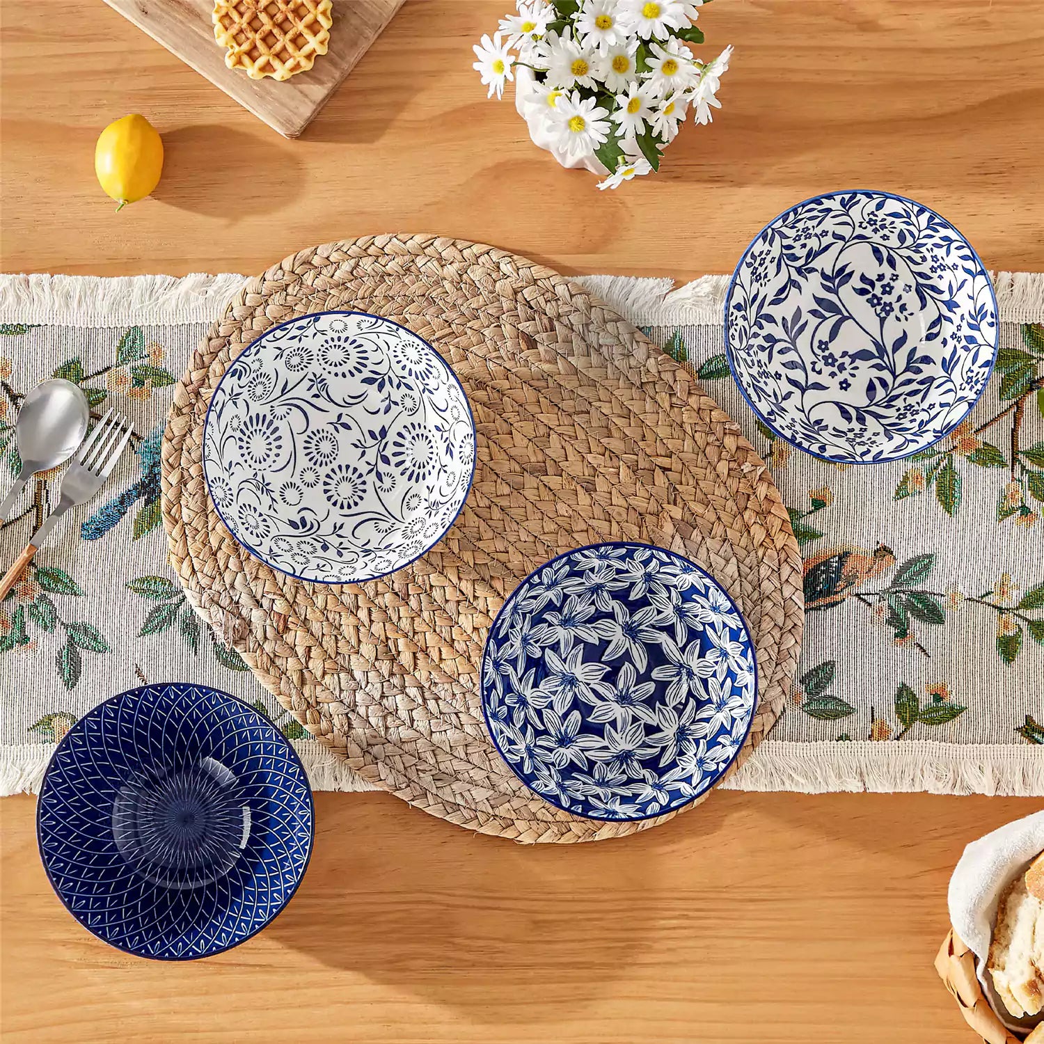 Selene porcelain cereal bowls set of 4 blue and white Japanese inspired floral pattern mix and match tableware styled with fruits and dishes on dining table