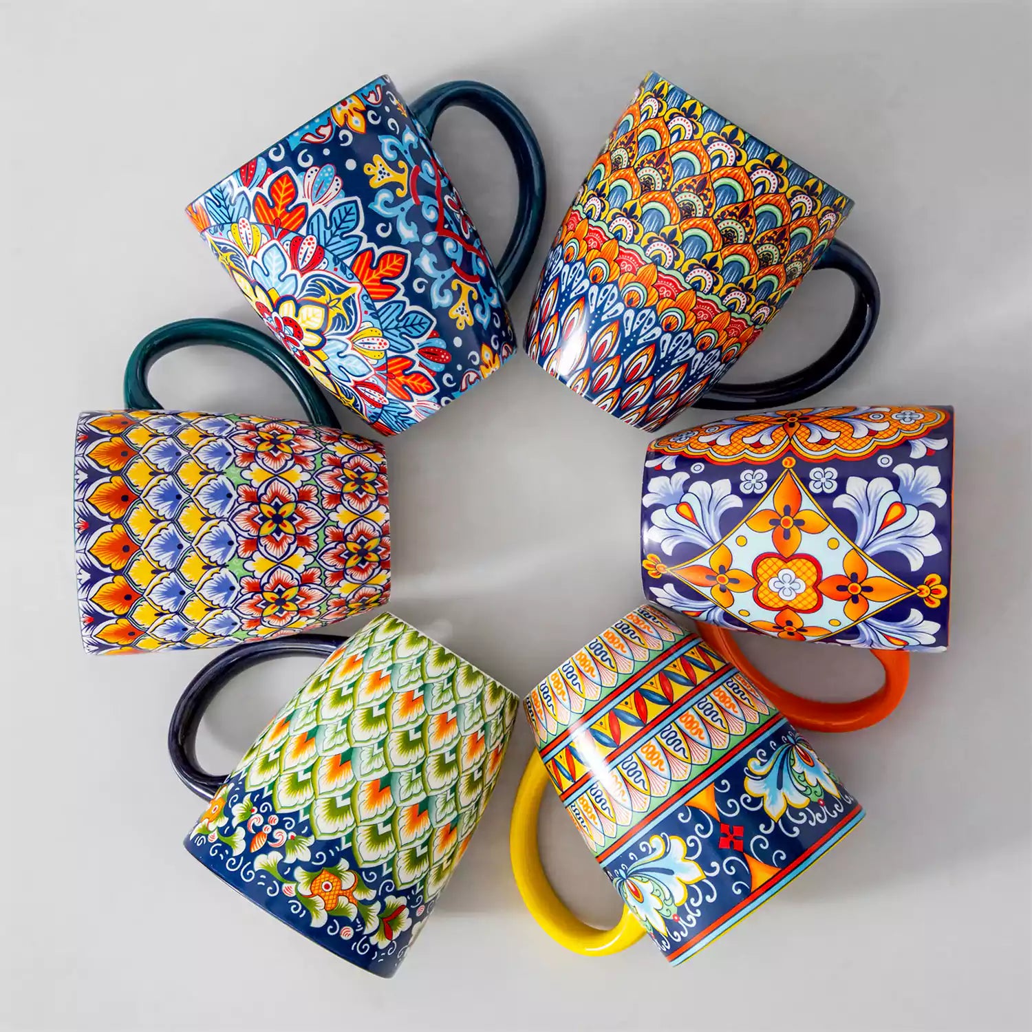 Boho-style coffee mugs filled with creamy latte, colorful porcelain set for cozy mornings