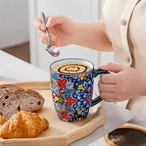 Boho-style coffee mugs filled with creamy latte, colorful porcelain set for cozy mornings