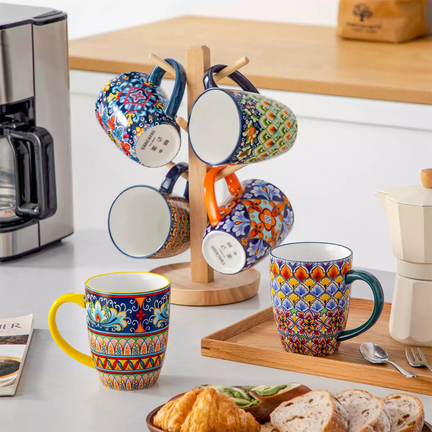Boho-style coffee mugs filled with creamy latte, colorful porcelain set for cozy mornings