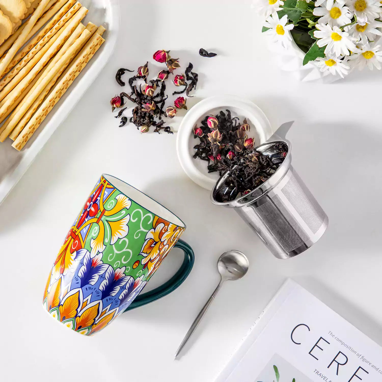 Simi tea mug with infuser and lid colorful hunter green boho chic ceramic coffee cup with spoon and loose tea leaves on white background 