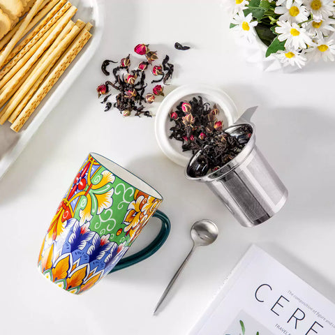 Simi tea mug with infuser and lid colorful hunter green boho chic ceramic coffee cup with spoon and loose tea leaves on white background 