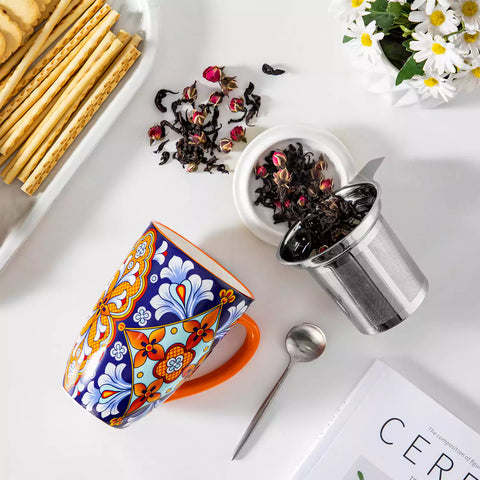 Simi tea mug with infuser and lid colorful bold orange boho chic ceramic coffee cup with spoon and loose tea leaves on white background