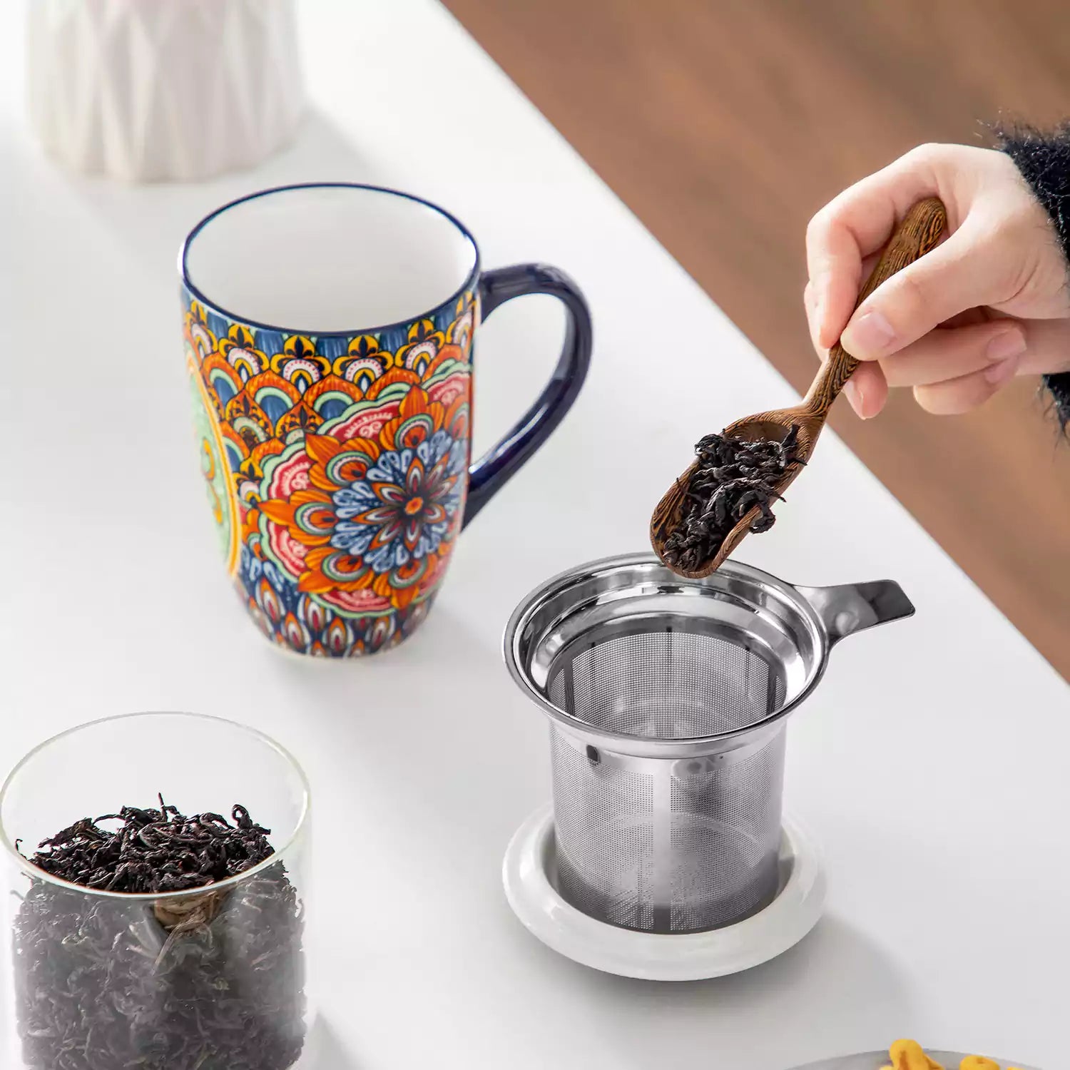 Simi tea mug with infuser and lid colorful forest green boho chic ceramic coffee cup with spoon and loose tea leaves on white background 