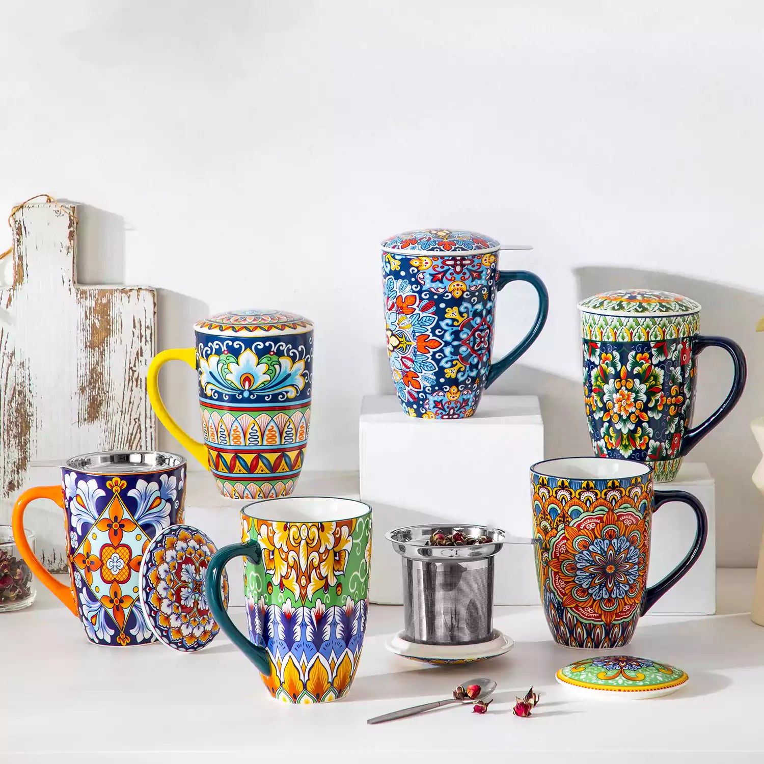 Simi tea mug with infuser and lid colorful navy blue boho chic ceramic coffee cup with spoon and loose tea leaves on white background