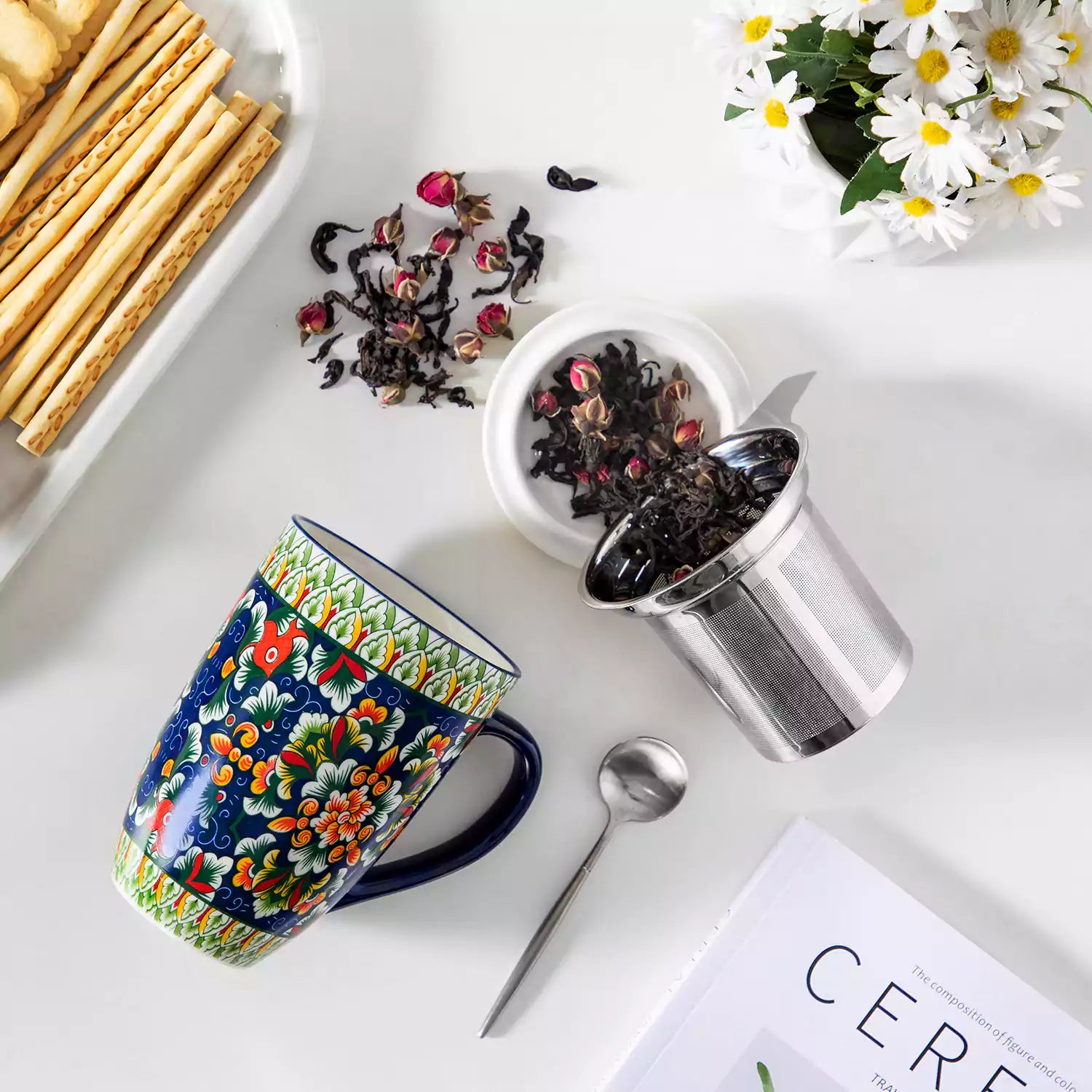 Simi tea mug with infuser and lid colorful midnight blue boho chic ceramic coffee cup with spoon and loose tea leaves on white background