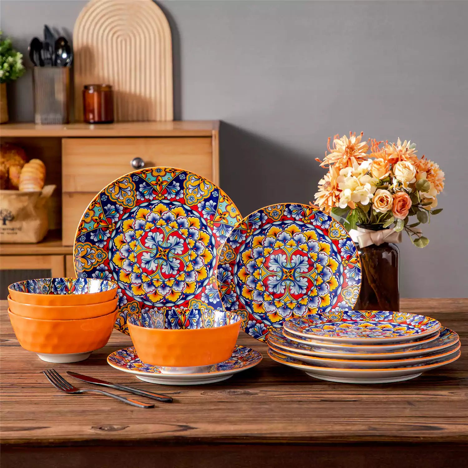 Bohemian-style 12-piece porcelain dinnerware set with front-only floral and geometric patterns in bold orange - modern and artistic table setting