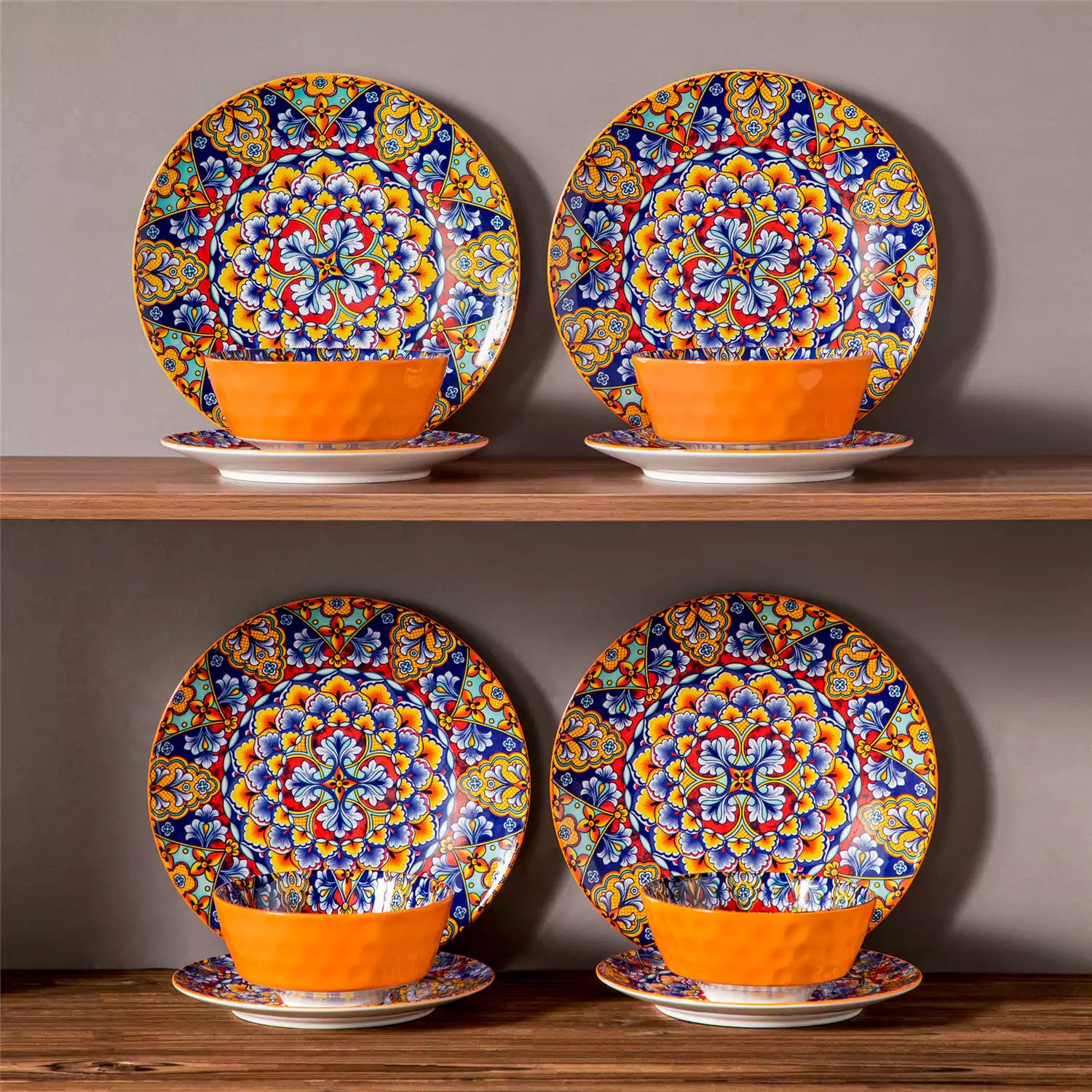 Bohemian-style 12-piece porcelain dinnerware set with front-only floral and geometric patterns in bold orange - modern and artistic table setting