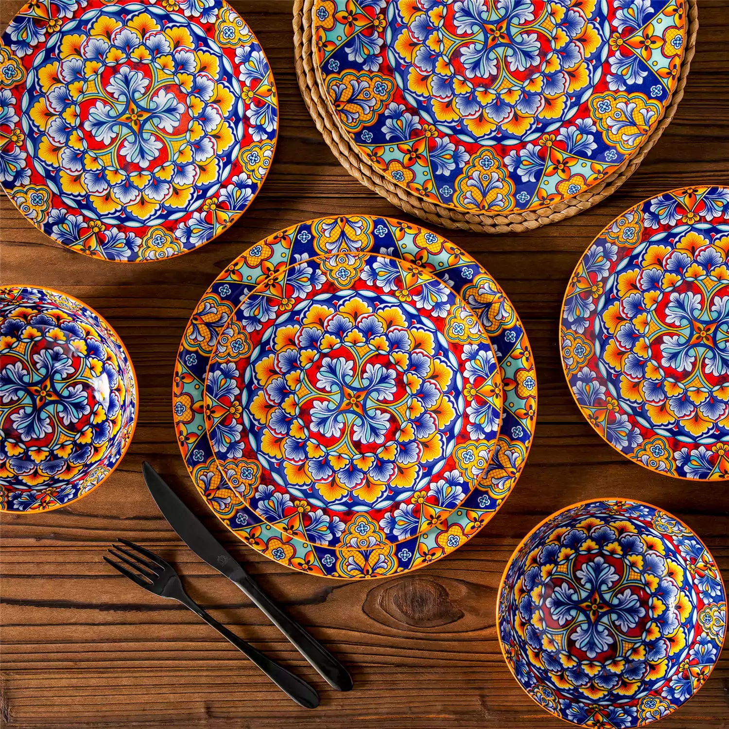 Bohemian-style 12-piece porcelain dinnerware set with front-only floral and geometric patterns in bold orange - modern and artistic table setting