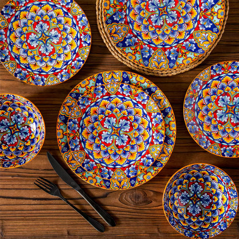 Bohemian-style 12-piece porcelain dinnerware set with front-only floral and geometric patterns in bold orange - modern and artistic table setting