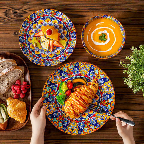 Bohemian-style 12-piece porcelain dinnerware set with front-only floral and geometric patterns in bold orange - modern and artistic table setting