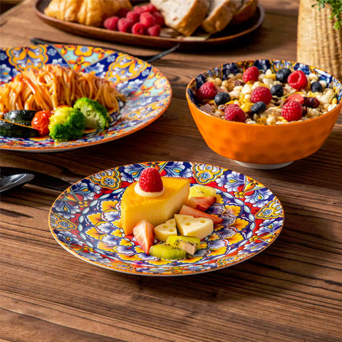 Bohemian-style 12-piece porcelain dinnerware set with front-only floral and geometric patterns in bold orange - modern and artistic table setting
