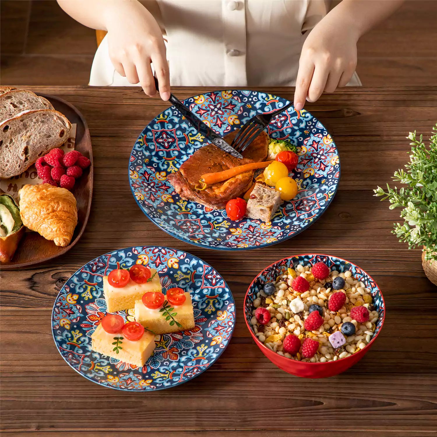 Bohemian-style 12-piece porcelain dinnerware set with front-only floral and geometric patterns in vivid red - modern and artistic table setting